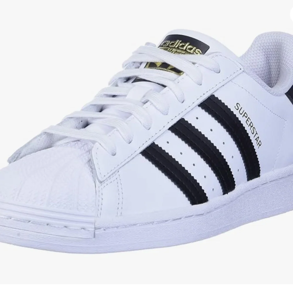 adidas Women’s White Sneakers with Black Stripes